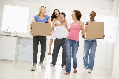 Mover carefully loading boxed items into a van