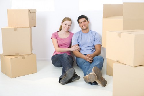 Packed office boxes and furniture ready for commercial relocation
