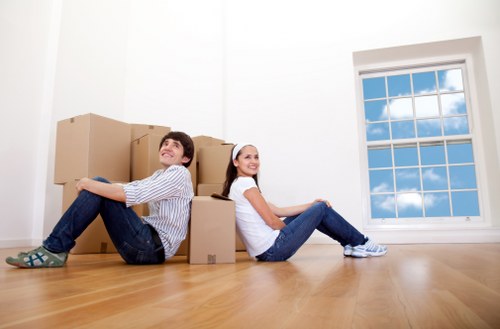 Furniture and boxes being unloaded at a new home in Epsom