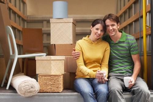 Local moving truck loading household furniture and boxes