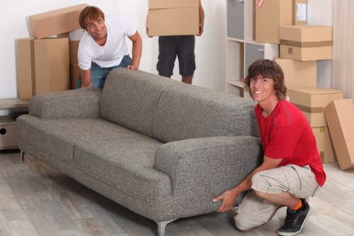 Loading household items into a removals van in Epsom