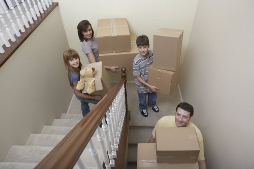 Careful loading of household items into a local removal van